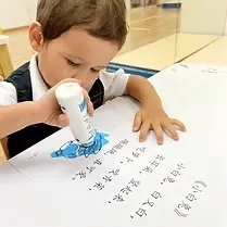 A child working on a Chinese character worksheet