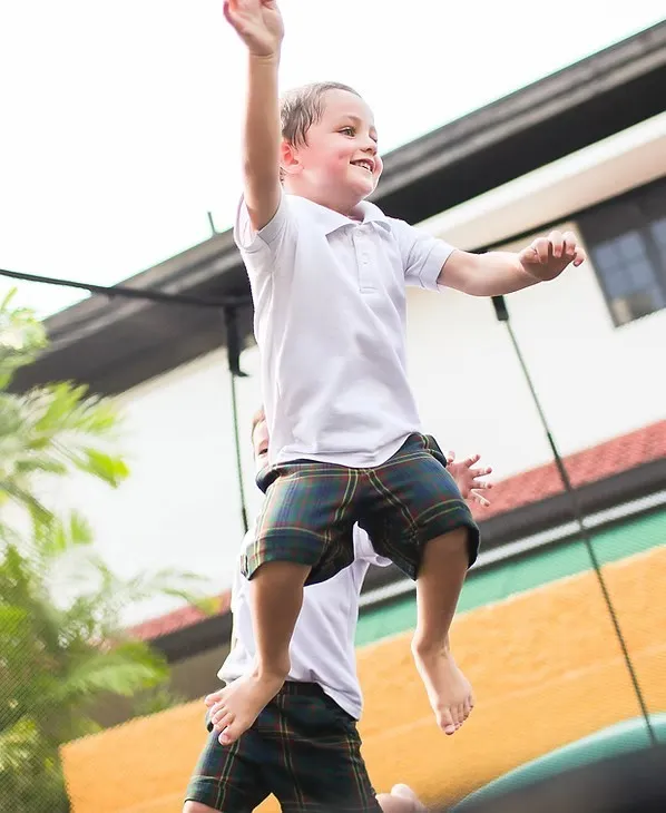 Child jumping on a trampoline