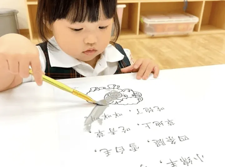 A child writing Chinese characters