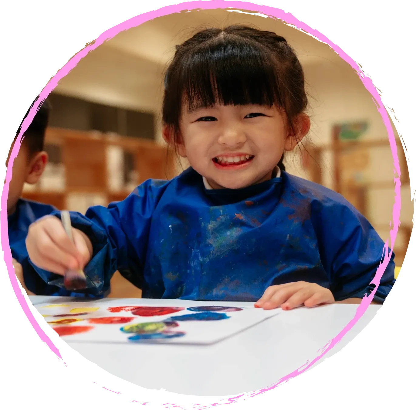 A smiling playgroup child