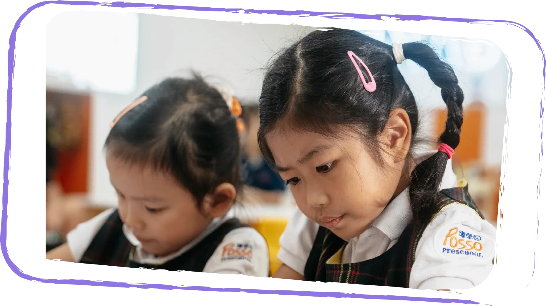 Kindergarten 2 children practising writing