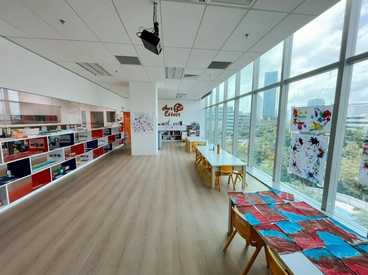 The ArtEffect art studio at Posso Jurong East, with paintings drying by the window