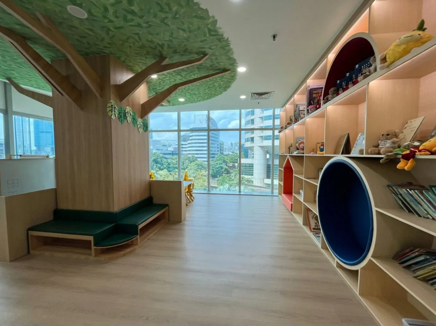 The children's library at Posso Jurong East, with its tree and reading nooks