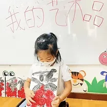 A child writing Chinese characters