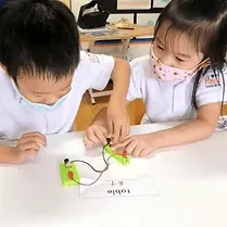 Two children doing a hands-on activity together