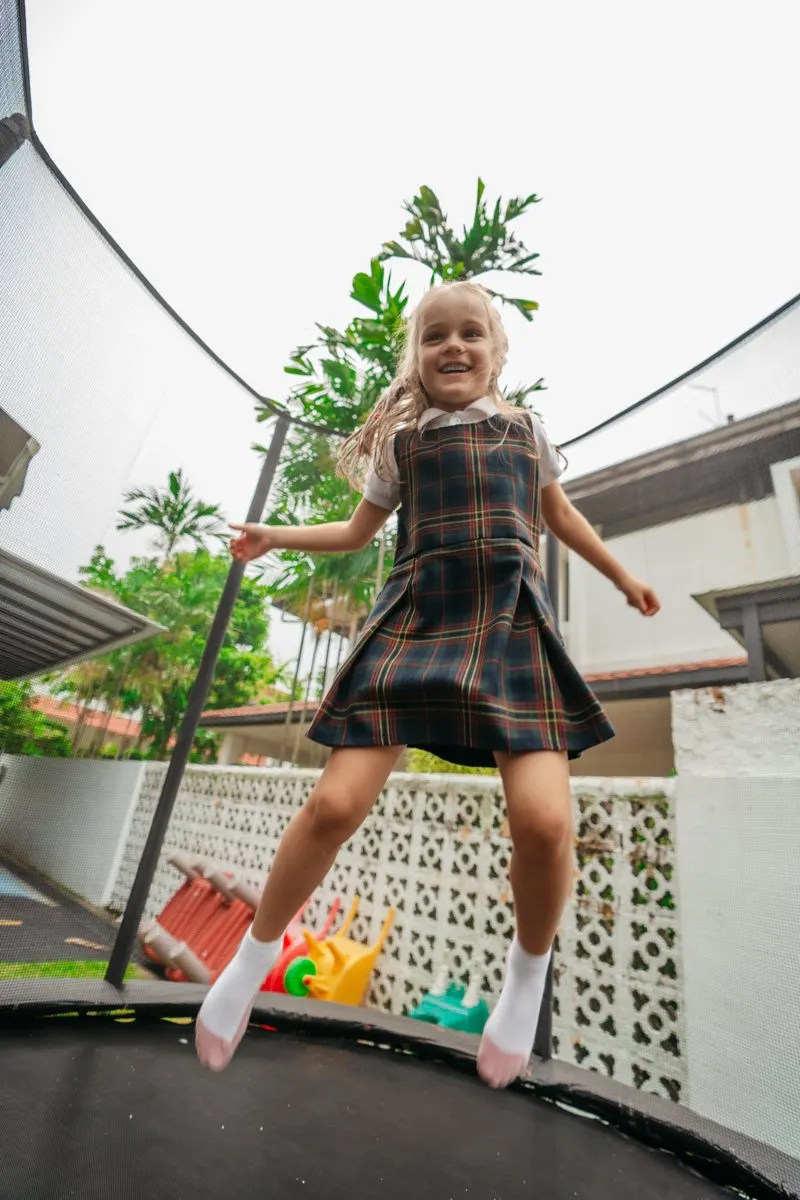 A child jumping on the outdoor trampoline at Posso West Coast Rise